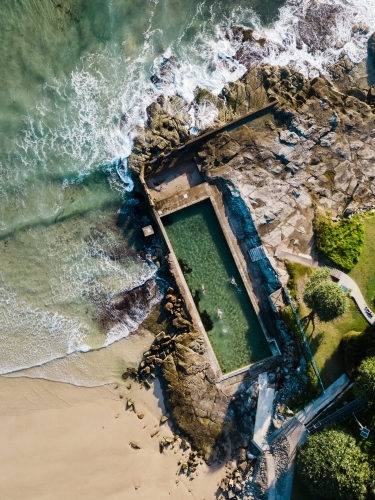 Swimmers in the ocean pool at Yamba - Australian Stock Image