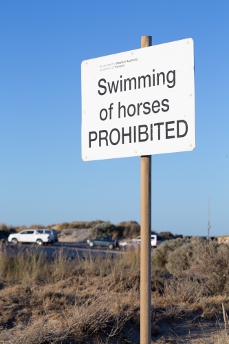 swimming of horses prohibited sign near beach - Australian Stock Image