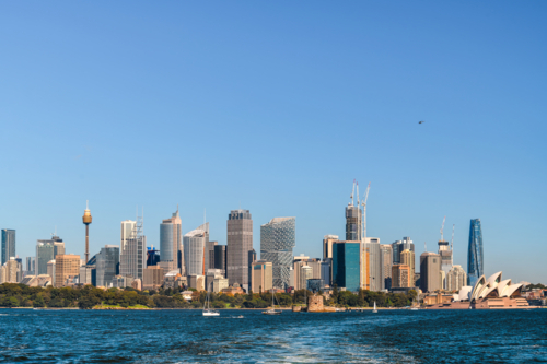 Sydney city skyline panorama viewed from ferry across the cove on a bright sunny day - Australian Stock Image