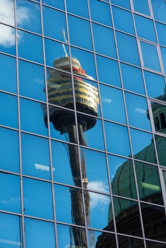 Sydney tower reflected in the windows of an office building