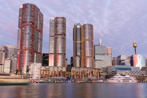 Sydney waterfront buildings against purple sky