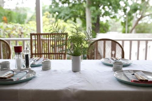 Table setting for lunch on verandah - Australian Stock Image