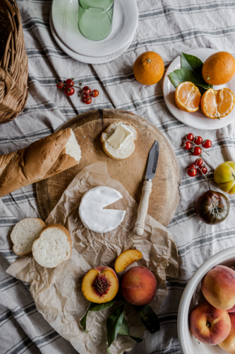 tablescape of a cheese and other picnic foods - Australian Stock Image