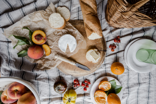 tablescape of a cheese and other picnic foods - Australian Stock Image