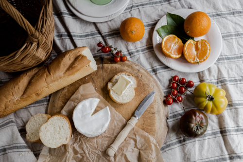 tablescape of a cheese and other picnic foods - Australian Stock Image