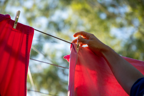 Taking clothes off the clothes line - Australian Stock Image