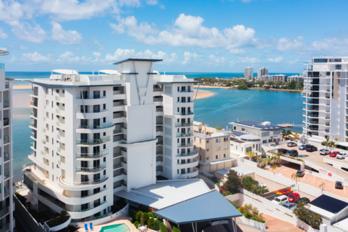 tall apartment buildings in a coastal town - Australian Stock Image