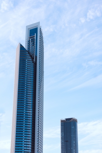 Tall skyscraper apartment buildings with blue sky background - Australian Stock Image
