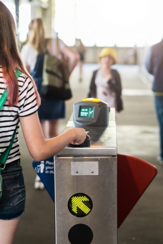 teen using travel card at ferry - Australian Stock Image