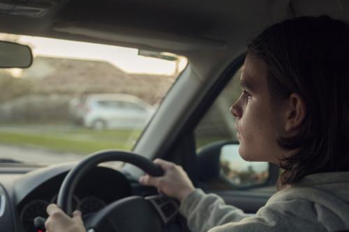 teenage boy driving - Australian Stock Image