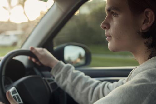 teenage boy driving - Australian Stock Image