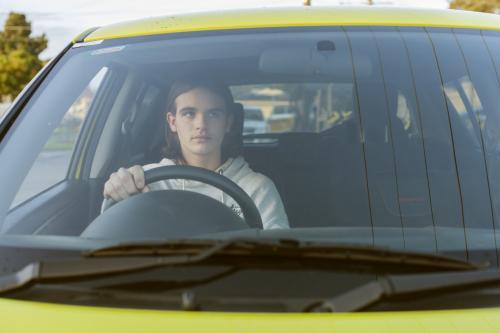 Teenage boy learning to drive