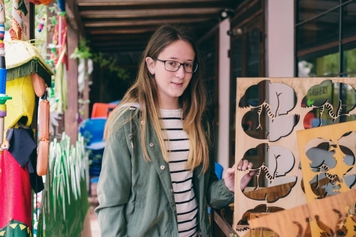teenager shopping at the recycle centre - Australian Stock Image