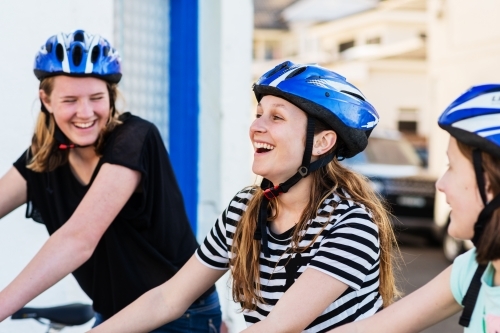 teens out riding a bike