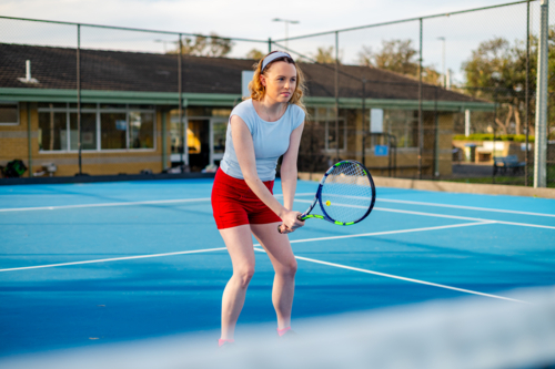 Tennis player at the net prepared for a tennis game - Australian Stock Image