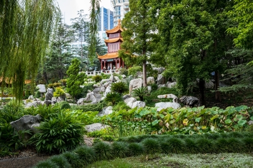 terraced garden with pavilion up to pavilion with city in background - Australian Stock Image