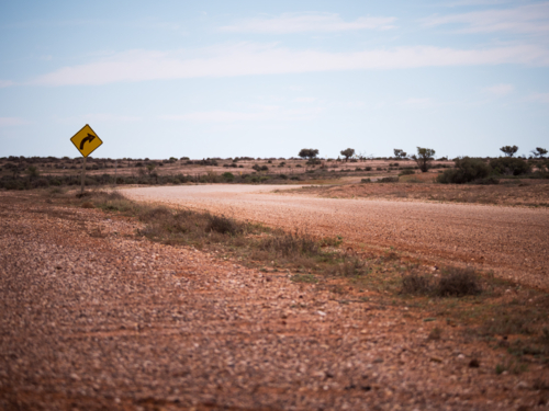 The bend in a lonely dirt road in outback Australia - Australian Stock Image