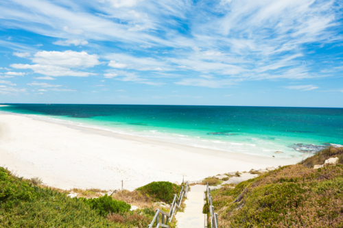 The clear blue beach and whites sands of Clayton Beach Mindarie Western Australia - Australian Stock Image