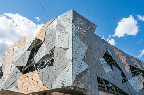 The facade of modern building made up of hundreds of triangular panels - Australian Stock Image