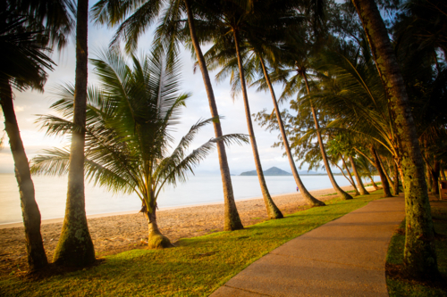 The famous idyllic beachfront of Palm Cove on a winter's day in Queensland, Australia - Australian Stock Image