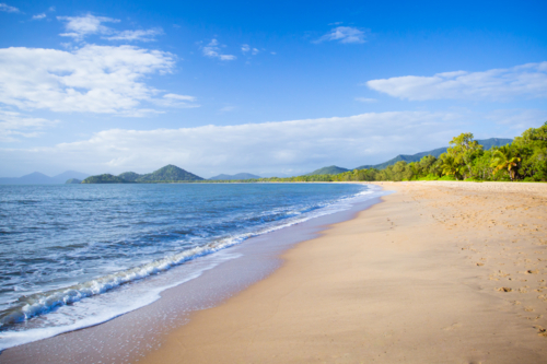 The famous idyllic beachfront of Palm Cove on a winter's day in Queensland, Australia - Australian Stock Image