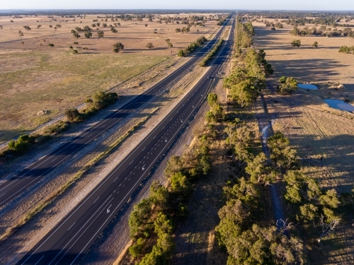 The Forrest Highway cutting through farmland in the Peel Region - Australian Stock Image