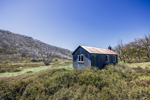 The historic Whites River Hut in Kosciuszko National Park near Schlink Pass on a clear summer day. - Australian Stock Image