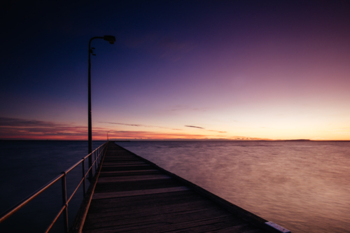 The iconic Rye Pier on a cool winter's morning at sunrise on the Mornington Peninsula in Melbourne, - Australian Stock Image