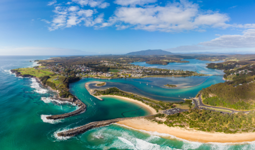 The idyllic coastal town of Narooma wrapped around the famous Wagonga Inlet in South Coast - Australian Stock Image
