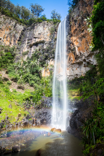 The majestic and iconic Purling Brook Falls on a warm autumn day in Springbrook National Park - Australian Stock Image