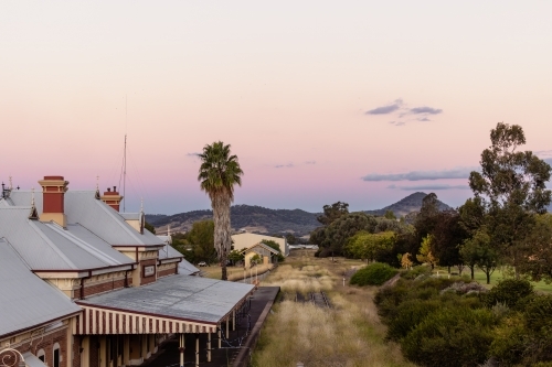 The Mudgee Railway Station at dusk with Mount Frome in background - Australian Stock Image