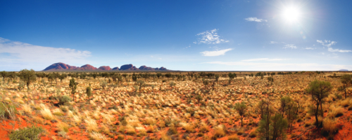 The Olgas and outback landscape on sunlit day - Australian Stock Image