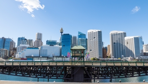 The Pyrmont Bridge when open to tall vessels, Cockle Bay. Sydney skyline in the background - Australian Stock Image