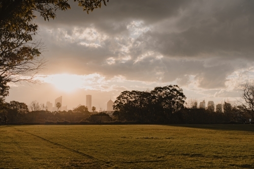 The Reservoir Fields sports field at sunset with Sydney city skyline in the distance