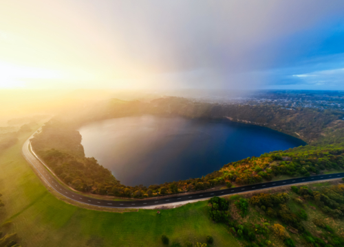 The rural town of Mt Gambier and its famous Blue Lake crater on a stormy autumn day. - Australian Stock Image