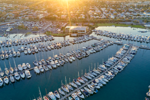 The sun rising over the city and a marina in Fremantle, Western Australia - Australian Stock Image