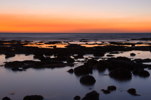 The sun sets at East Point on a summer's evening in Darwin, Northern Territory, Australia - Australian Stock Image