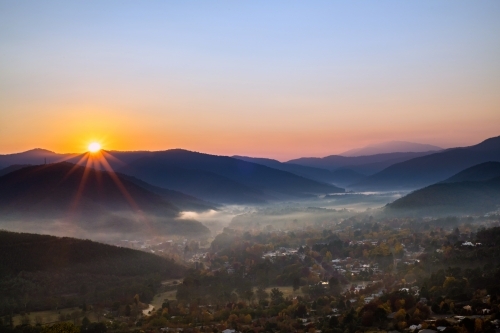 The sun shining over the autumn town in rural Australia - Australian Stock Image
