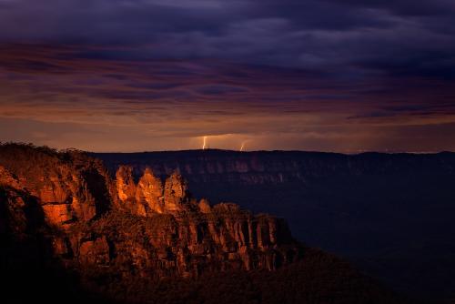 The Three Sisters at night with lightning bolts - Australian Stock Image