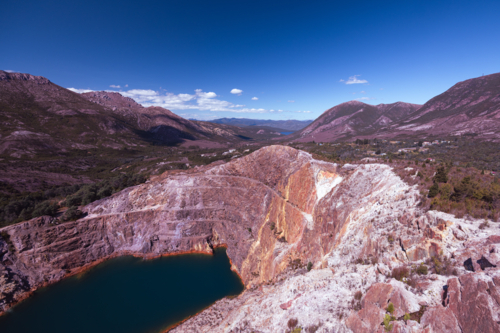 The view of Iron Blow Lookout on a hot summer's afternoon in Queenstown, Tasmania, Australia - Australian Stock Image