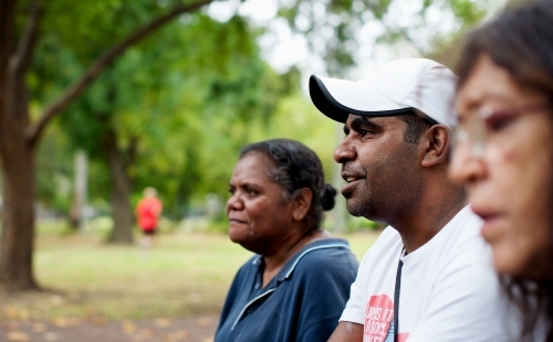 Three Aboriginal Australian People Outdoors in Profile - Australian Stock Image