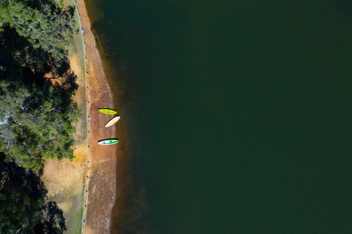 Three kayaks on the shore - Australian Stock Image