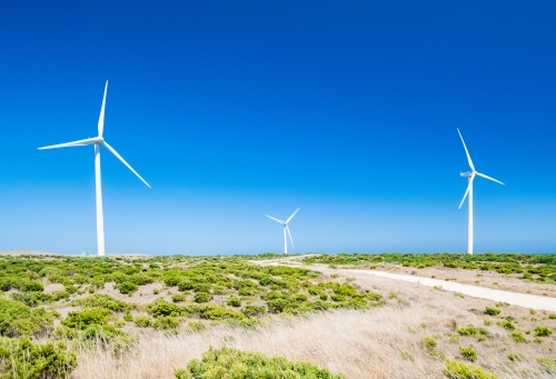Three Wind turbines against the blue sky at a wind farm. - Australian Stock Image