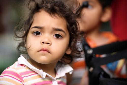 Three year old Aboriginal GirlLooking at Camera - Australian Stock Image