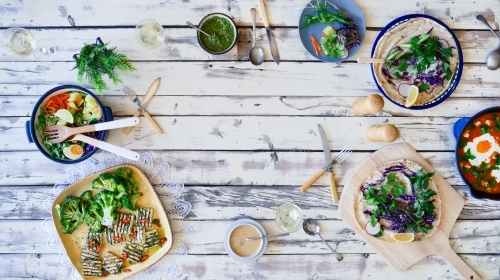 Top down of table set with healthy dishes - Australian Stock Image