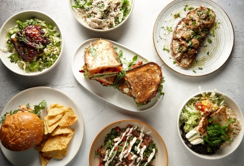Top down of various appetising dishes on table - Australian Stock Image