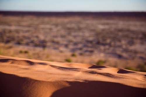 Top of red sand dune in desert