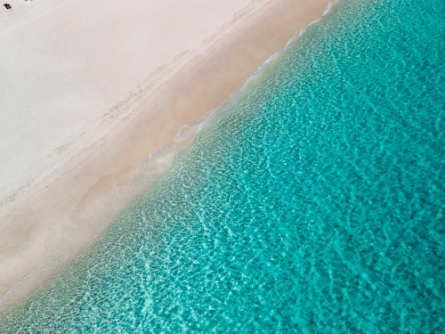 top shot of a white sand beach on a sunny day - Australian Stock Image