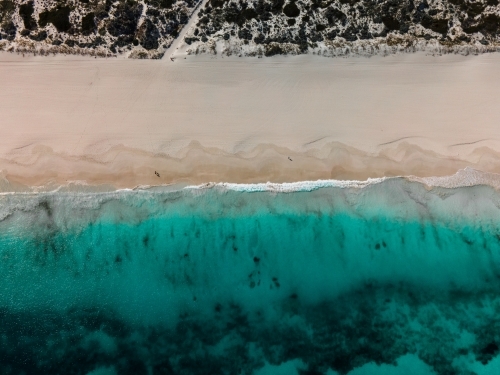 top shot of Summers in Perth with white sand, green grass and ocean water