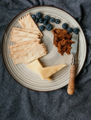 Top view of a blueberry and cheese platter
